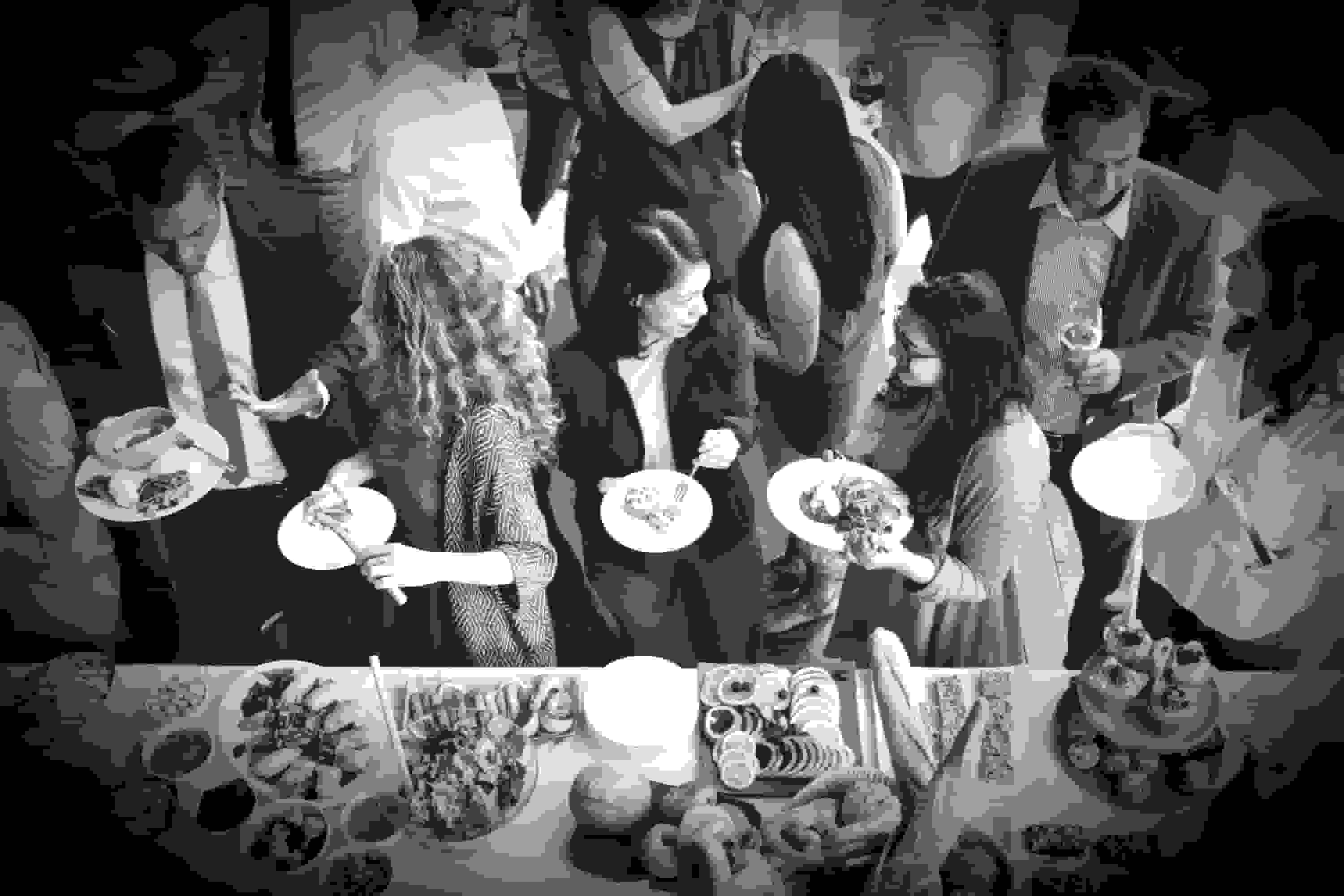 People at a party function with catered food
